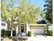 Charming two-story home with a lovely front porch and attractive landscaping in a serene neighborhood setting at 1027 Banks Rose St, Celebration, FL 34747