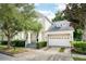 Beautiful two-story home with a well-maintained lawn and attached garage at 1027 Banks Rose St, Celebration, FL 34747