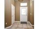 Inviting foyer with neutral colors, tile flooring, and a front door featuring decorative glass at 1027 Banks Rose St, Celebration, FL 34747