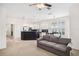 Open concept floor plan with living room flowing into kitchen and dining area; neutral walls and carpet at 1027 Banks Rose St, Celebration, FL 34747