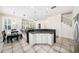 Bright, open-concept living area featuring a kitchen island, dining space, and living room at 1027 Banks Rose St, Celebration, FL 34747