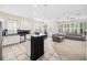 Spacious open floor plan with a kitchen island connecting to the living area at 1027 Banks Rose St, Celebration, FL 34747
