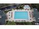 Aerial view of the community pool with lounge chairs and umbrellas at 1027 Banks Rose St, Celebration, FL 34747