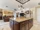Kitchen with a granite island that provides ample counter space, seating, and storage, perfect for entertaining at 1233 Cambria Bnd, Kissimmee, FL 34759