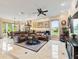 Open-concept living room boasts natural light and plenty of space for relaxation, seamlessly flowing to the dining area at 1233 Cambria Bnd, Kissimmee, FL 34759