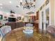 Open-concept living room flowing into kitchen, featuring a stone accent wall at 1233 Cambria Bnd, Kissimmee, FL 34759