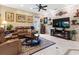 Inviting living room with stone accent wall, providing a cozy and elegant space for relaxation and entertainment at 1233 Cambria Bnd, Kissimmee, FL 34759