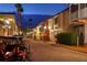 Quaint, brick-paved street lined with Mediterranean-style buildings and cozy lighting at 1233 Cambria Bnd, Kissimmee, FL 34759
