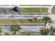 Aerial view of Bermuda Palms sign and entryway with lush palm trees at 1240 Sago Palm Blvd # 1240, Kissimmee, FL 34741