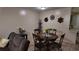 Cozy dining area, adjacent to living room with a decorative table perfect for Gathering meals at 1240 Sago Palm Blvd # 1240, Kissimmee, FL 34741
