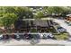 Aerial view of multi-Gathering home with parking, mature trees, and community pool at 1240 Sago Palm Blvd # 1240, Kissimmee, FL 34741
