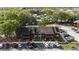 Aerial view of multi-Gathering home with parking, mature trees, and community pool at 1240 Sago Palm Blvd # 1240, Kissimmee, FL 34741