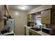 Cozy kitchen with laminate countertops and appliances, offering functionality and charm at 1240 Sago Palm Blvd # 1240, Kissimmee, FL 34741