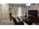 Comfortable living room features tile flooring, ceiling fan, and ample space for relaxation and entertainment at 1240 Sago Palm Blvd # 1240, Kissimmee, FL 34741