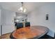 Dining area features wood table, chairs, and is adjacent to the kitchen and other living spaces at 1437 Swift Ct, Kissimmee, FL 34759