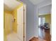 Bathroom and bedroom view featuring a shower with curtain and decorative chair at 1437 Swift Ct, Kissimmee, FL 34759