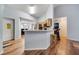 Open-concept kitchen with breakfast bar and laminate wood flooring at 1437 Swift Ct, Kissimmee, FL 34759