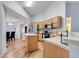 Well-lit kitchen with stainless steel appliances, ample counter space, and laminate floors at 1437 Swift Ct, Kissimmee, FL 34759