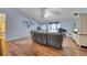 Open living room with laminate floors, lots of natural light, and neutral wall paint at 1437 Swift Ct, Kissimmee, FL 34759