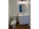 Bright bathroom featuring a white vanity, modern lighting, and a clean, simple design at 1749 Sorolla Ct, Orlando, FL 32811