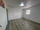 Clean, well-lit bedroom with updated flooring and a bright window at 1749 Sorolla Ct, Orlando, FL 32811