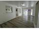 Open-concept living room featuring modern flooring and an open doorway at 1749 Sorolla Ct, Orlando, FL 32811