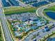 An aerial view of a community with a large pool and waterpark area at 2569 Reading Trl, Kissimmee, FL 34746