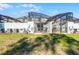 Home's backyard featuring an enclosed lanai area with a sparkling swimming pool at 2569 Reading Trl, Kissimmee, FL 34746