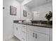 This bathroom features a double vanity with modern finishes and decor at 2569 Reading Trl, Kissimmee, FL 34746