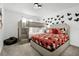 Whimsical bedroom with a bunk bed, a queen bed, and a Mickey Mouse theme at 2569 Reading Trl, Kissimmee, FL 34746