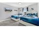 This bedroom features two twin beds with video game themed decor at 2569 Reading Trl, Kissimmee, FL 34746