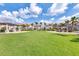 Well-maintained lawn with outdoor seating, grill, and pergola, ideal for gatherings at 2569 Reading Trl, Kissimmee, FL 34746