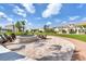 Community outdoor fire pit area with chairs and landscaped surroundings at 2569 Reading Trl, Kissimmee, FL 34746