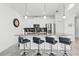 Bright kitchen with stainless steel appliances, breakfast bar with seating and modern finishes at 2569 Reading Trl, Kissimmee, FL 34746
