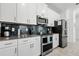 Well-equipped kitchen with stainless steel appliances, sleek countertops, and ample cabinet space at 2569 Reading Trl, Kissimmee, FL 34746