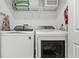 This laundry room features a side-by-side washer and dryer at 2569 Reading Trl, Kissimmee, FL 34746