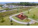 Aerial view of the community playground area with slide and playhouse at 2569 Reading Trl, Kissimmee, FL 34746