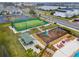 A playground and turf soccer field for to play located next to the pool area at 2569 Reading Trl, Kissimmee, FL 34746