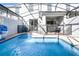 The screened-in pool offers privacy and a seamless indoor-outdoor living experience at 2569 Reading Trl, Kissimmee, FL 34746