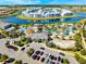 Aerial view of a resort-style pool with a lazy river, water slides, and plenty of palm trees around the apartment complex at 2569 Reading Trl, Kissimmee, FL 34746