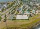 Aerial view of waterpark-style community pool with lazy river, beach volleyball and basketball courts at 2569 Reading Trl, Kissimmee, FL 34746