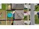 Aerial view of property featuring a backyard pool, well-maintained lawn, and ample parking at 260 Willow Bend Dr, Davenport, FL 33897
