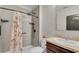 The full bathroom features a walk-in shower with a rainfall shower head and neutral-toned tiling at 260 Willow Bend Dr, Davenport, FL 33897
