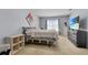 Bright bedroom features a comfortable bed, a TV, and soft natural light from the window at 260 Willow Bend Dr, Davenport, FL 33897