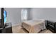 Bedroom with a double bed, dresser, side table, and TV creating a comfortable and functional living space at 260 Willow Bend Dr, Davenport, FL 33897