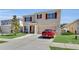 Well-kept home featuring red shutters, manicured lawn, and a spacious driveway for convenient parking at 260 Willow Bend Dr, Davenport, FL 33897