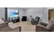 Cozy living room with a TV, comfortable seating, and large window with natural light at 260 Willow Bend Dr, Davenport, FL 33897