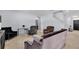 Spacious living room with neutral colors, offering lots of seating, natural light, and an airy feel at 260 Willow Bend Dr, Davenport, FL 33897
