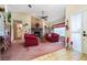 Comfortable living room featuring a brick fireplace, ceiling fan, and classic furnishings at 2718 Nakina Ct, Orlando, FL 32837