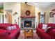 Bright living room features a brick fireplace and comfortable seating at 2718 Nakina Ct, Orlando, FL 32837